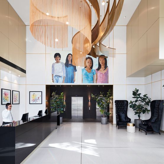 An artistic, open plan hotel lobby with art on the walls